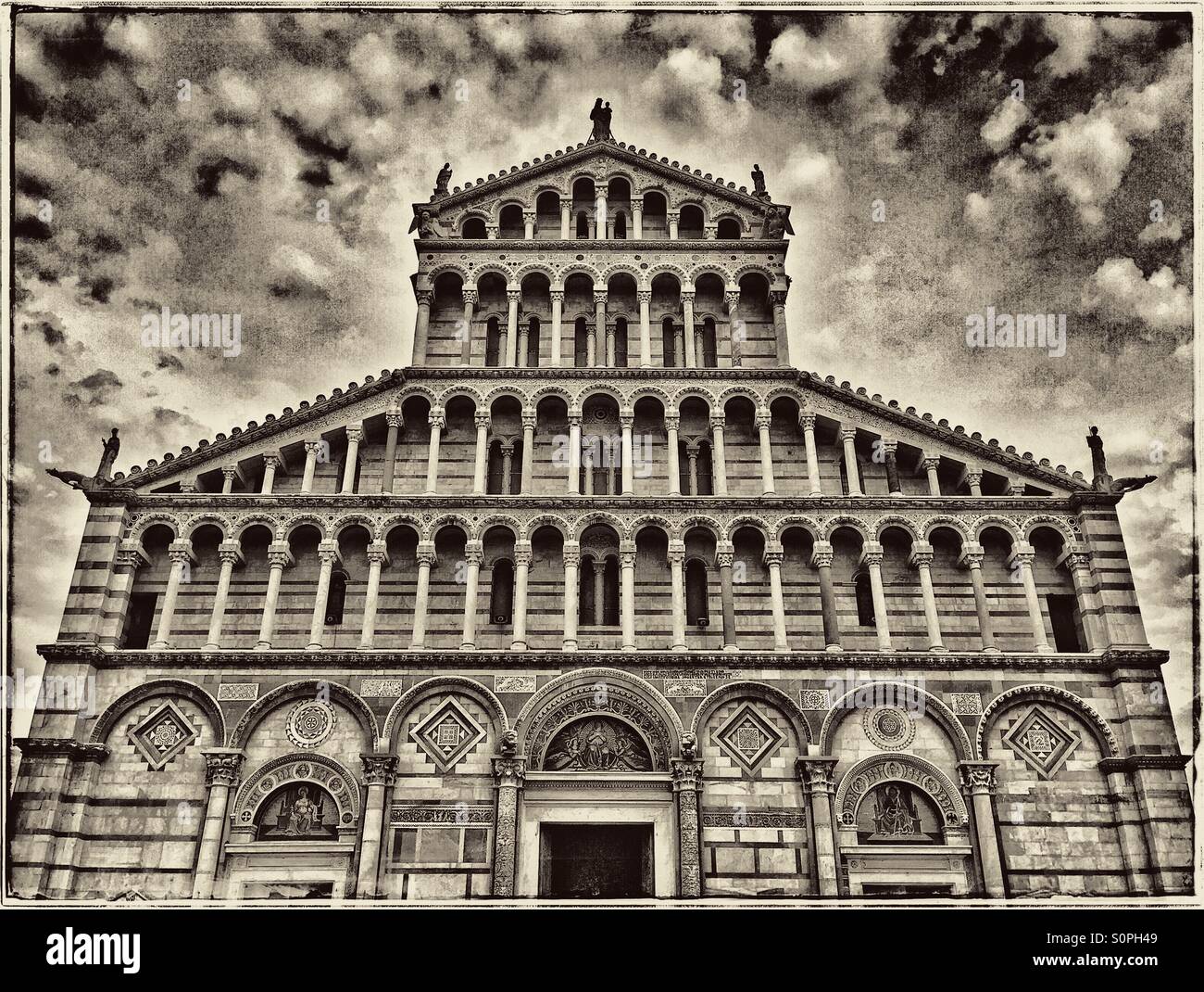 A view of the West Facing Facade of Santa Maria Assunta (St. Mary of the Assumption) in The Field of Miracles, Pisa, Tuscany, Italy. Construction started in 1064. Photo Credit - © COLIN HOSKINS. - Smartphone Captured Stock Image