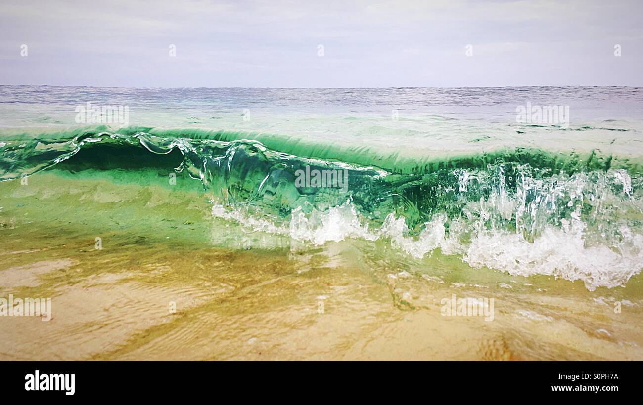 Waves crashing onto a sandy beach - Smartphone Captured Stock Image