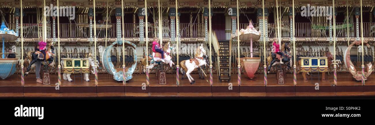 iPhone panorama created by a moving merry go round on the harbourside at Honfleur, Normandy, France. Instagram style iPhone mobile phone photo. - Smartphone Captured Stock Image