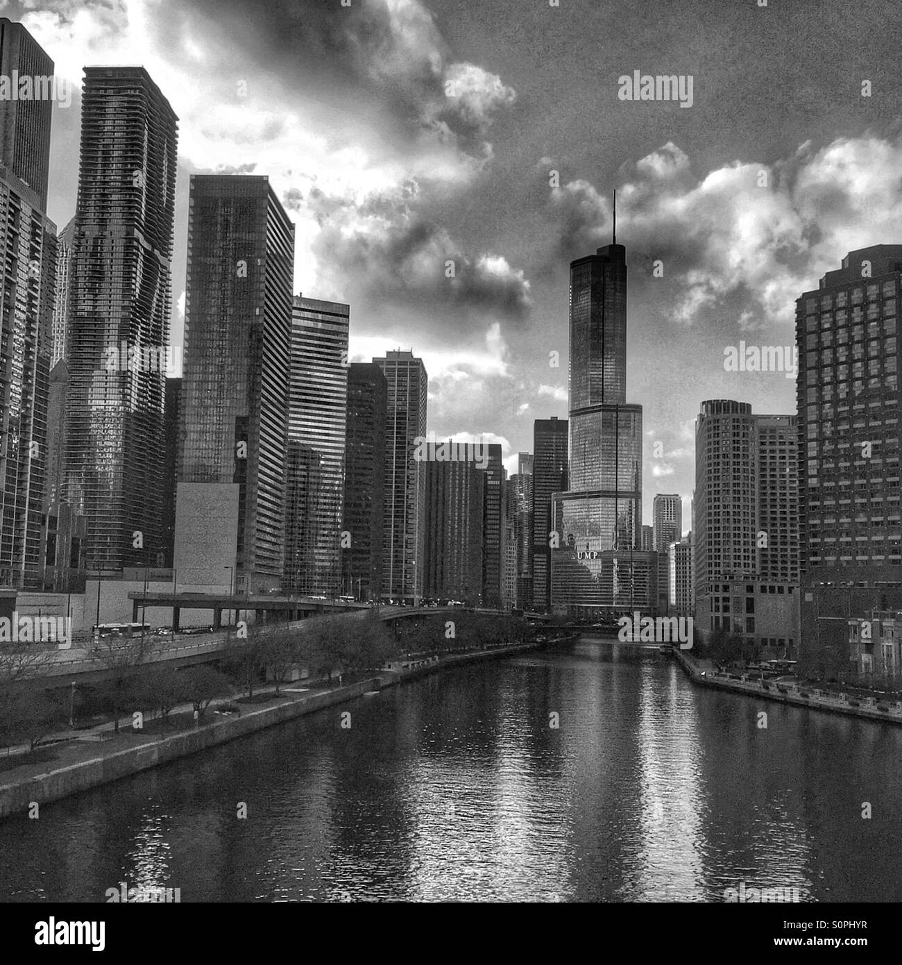 Black and white view of high rise skyscrapers along the Chicago River in downtown Chicago, Illinois, USA - Smartphone Captured Stock Image