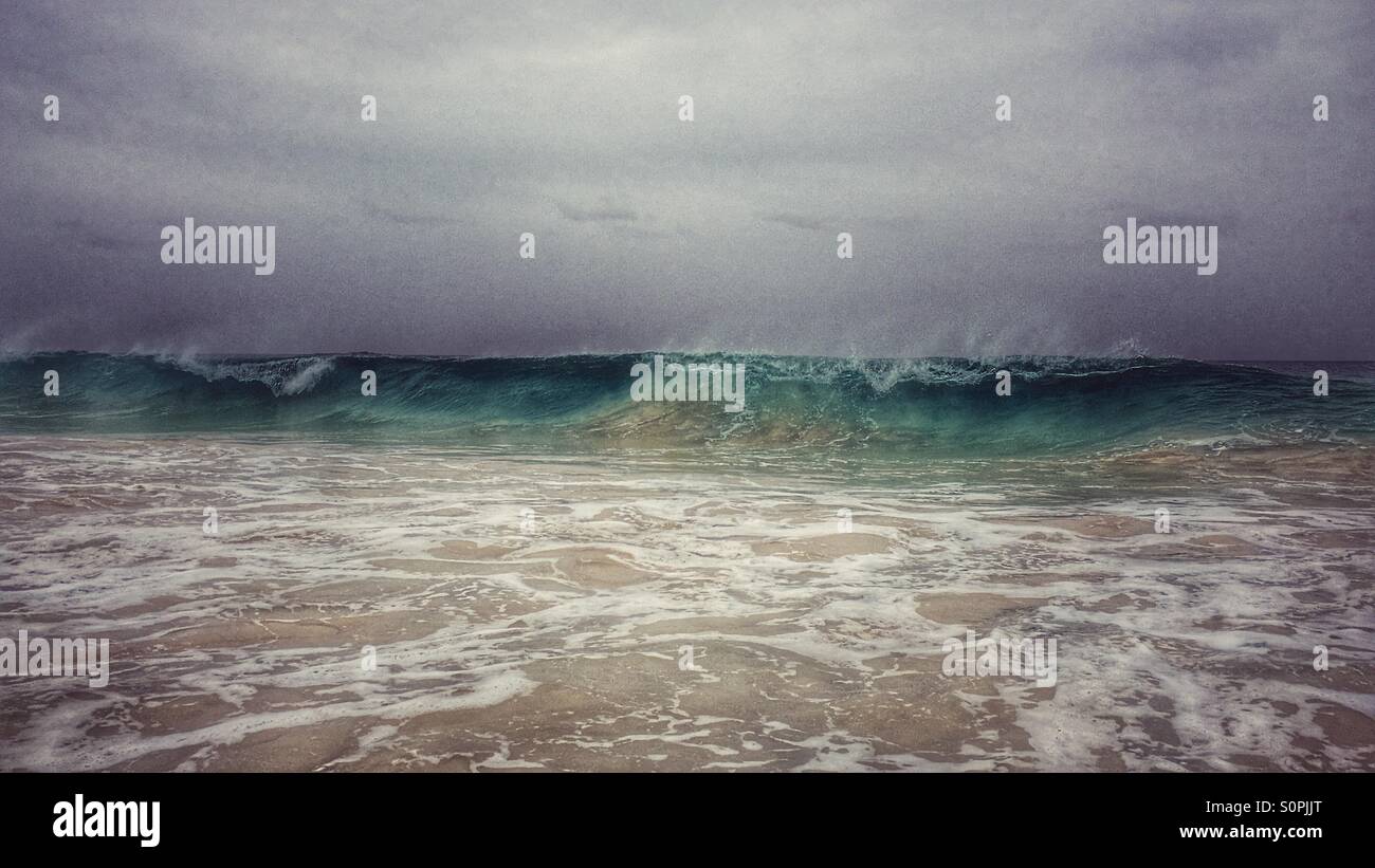 Dramatic weather as a wave starts to break with foaming sea - Smartphone Captured Stock Image