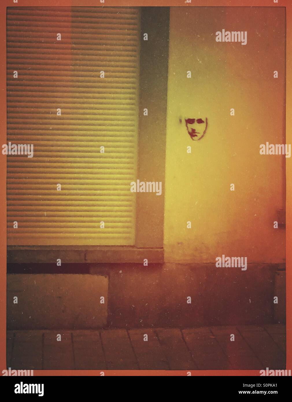 Graffiti face on a wall - Smartphone Captured Stock Image