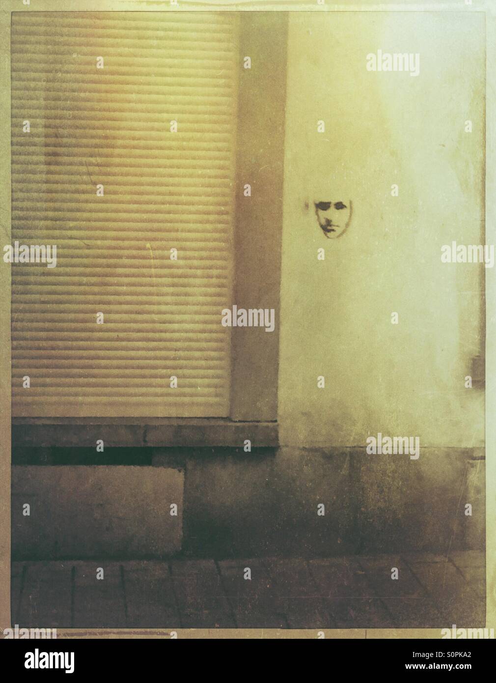 Graffiti face on a wall - Smartphone Captured Stock Image