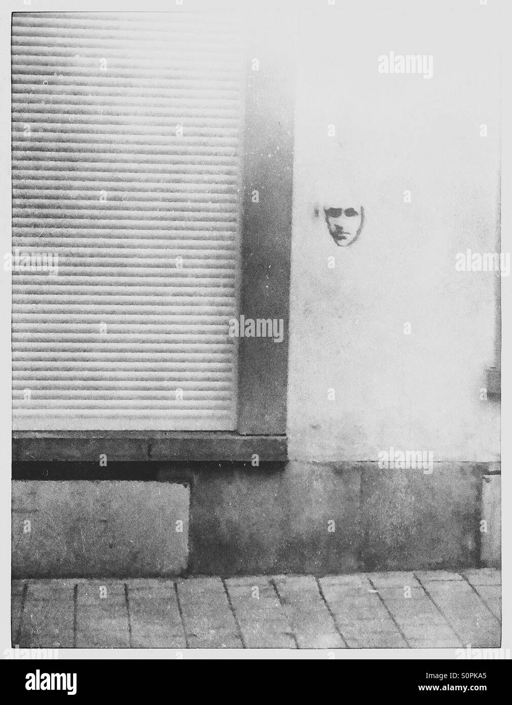 Graffiti face on a wall - Smartphone Captured Stock Image