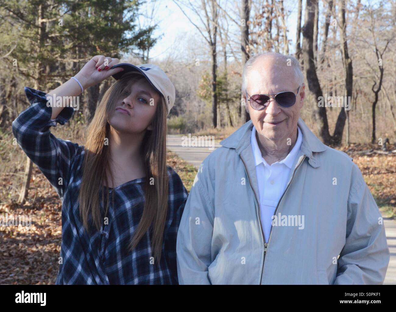 Cool girl with hat with grandpa Stock Photo