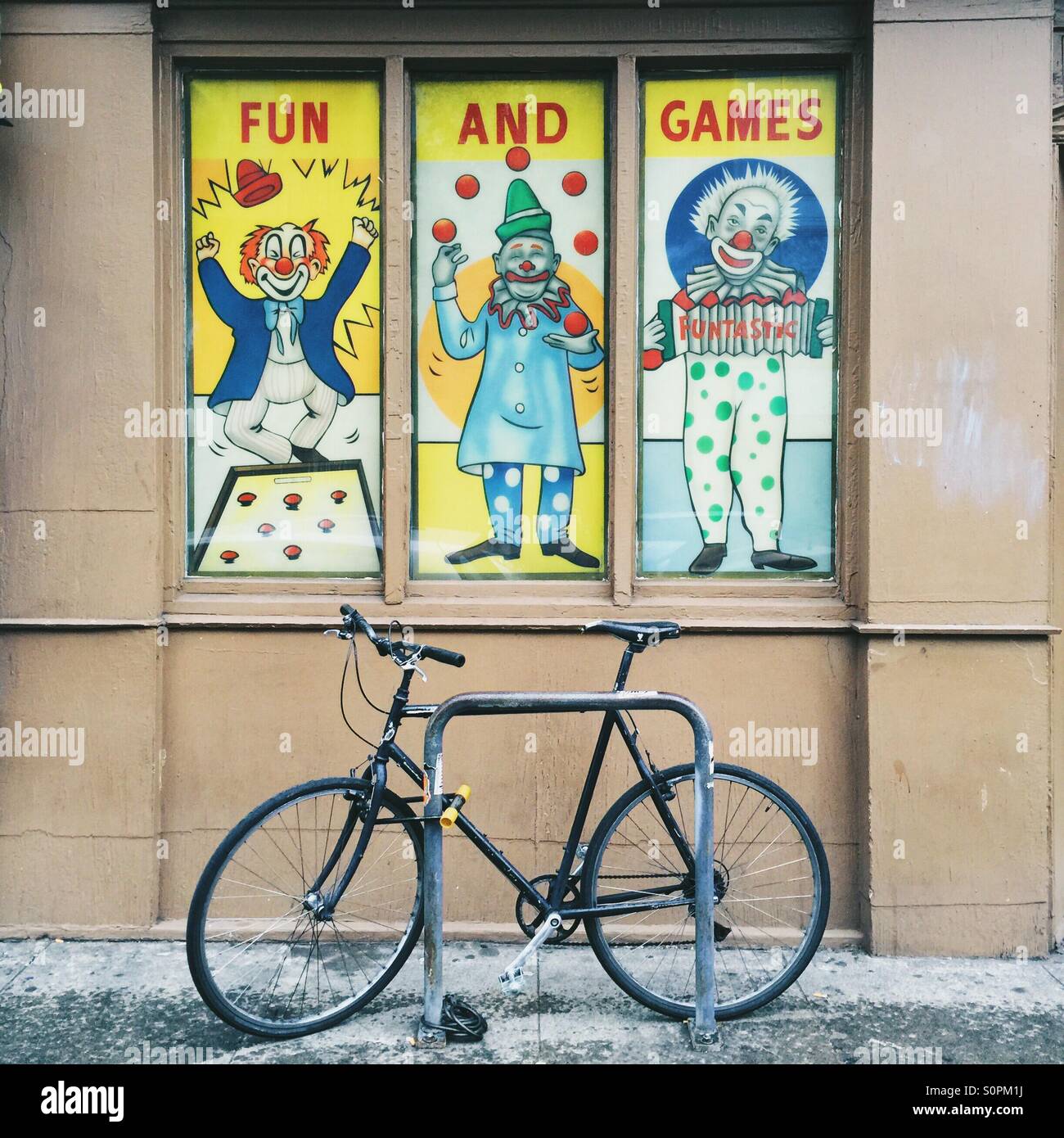 Portland Fun and Games sign and a bicycle - Smartphone Captured Stock Image