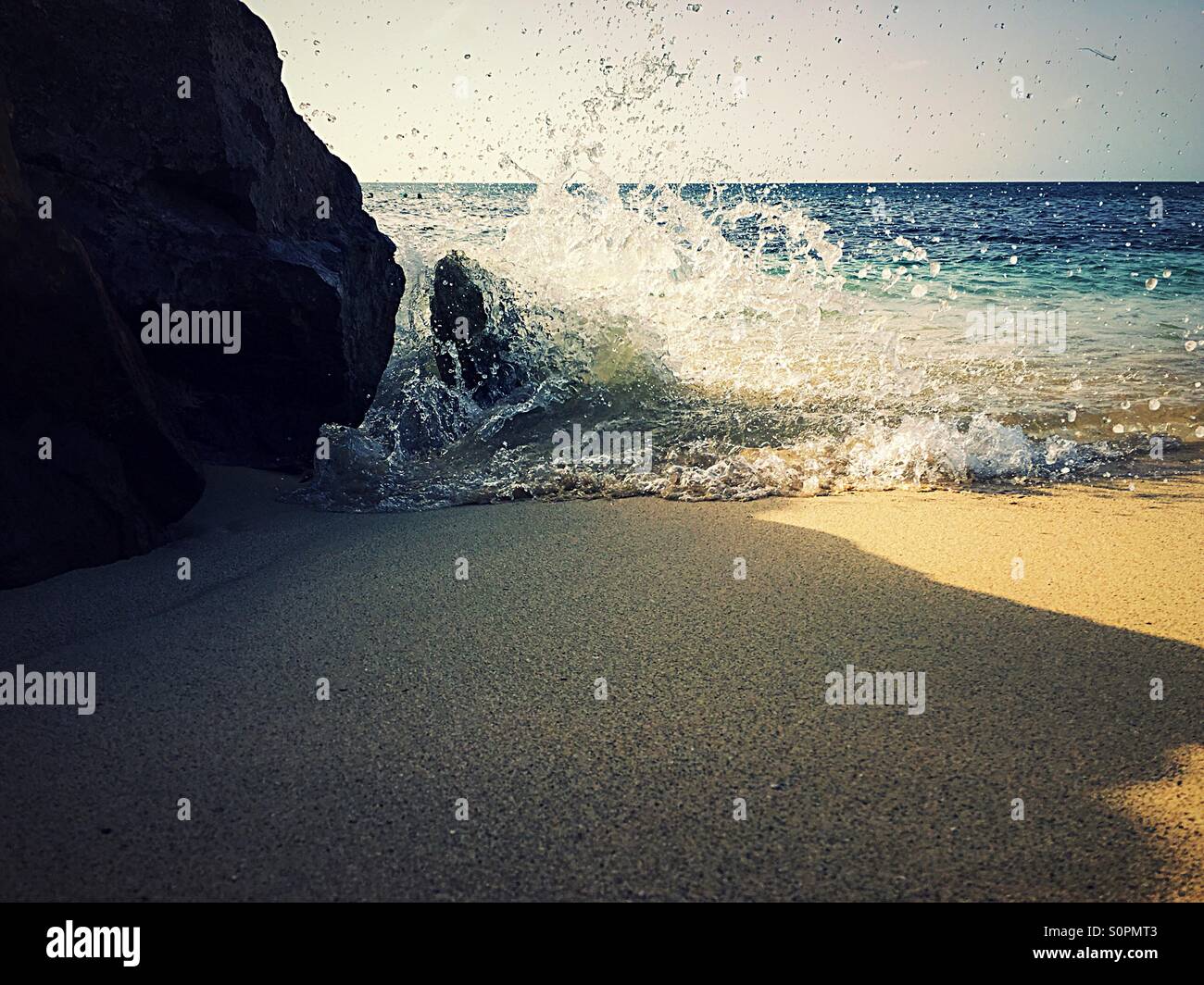 Waves crashing against rocks - Smartphone Captured Stock Image