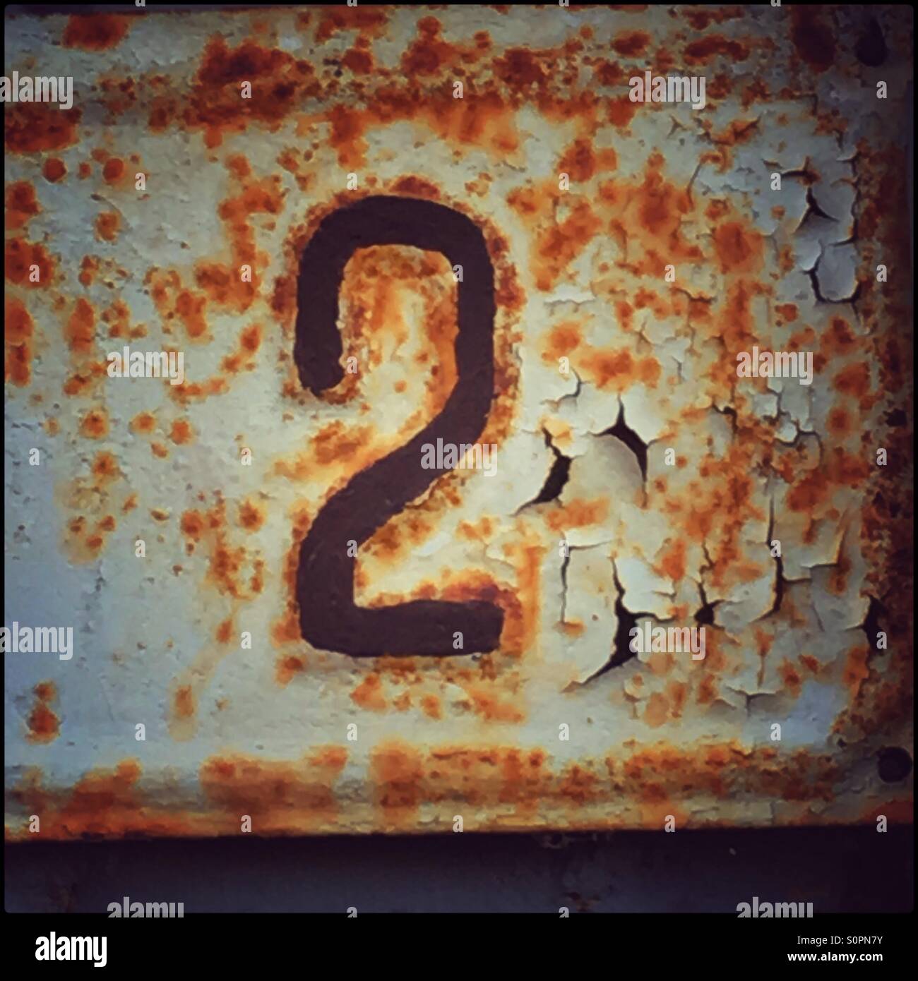Number 2 on rusty table - Smartphone Captured Stock Image