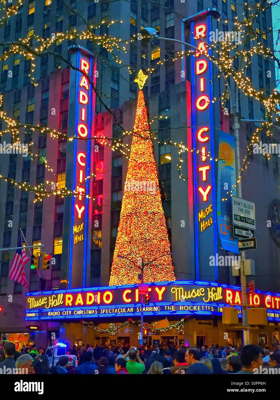 NYC's famous radio city music Hall is decorated for the holidays with a huge lit Christmas tree - Smartphone Captured Stock Image