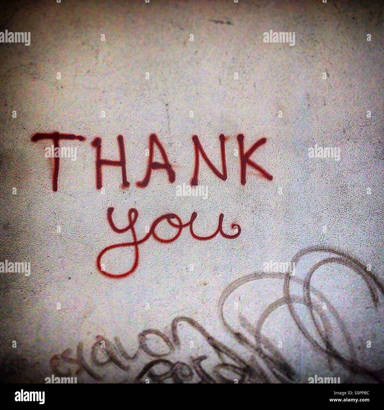 A graffiti reading 'Thank you' decorates a wall in Colonia Roma, Mexico City, Mexico - Smartphone Captured Stock Image