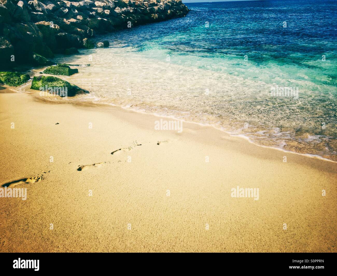 Footsteps into the sea - Smartphone Captured Stock Image