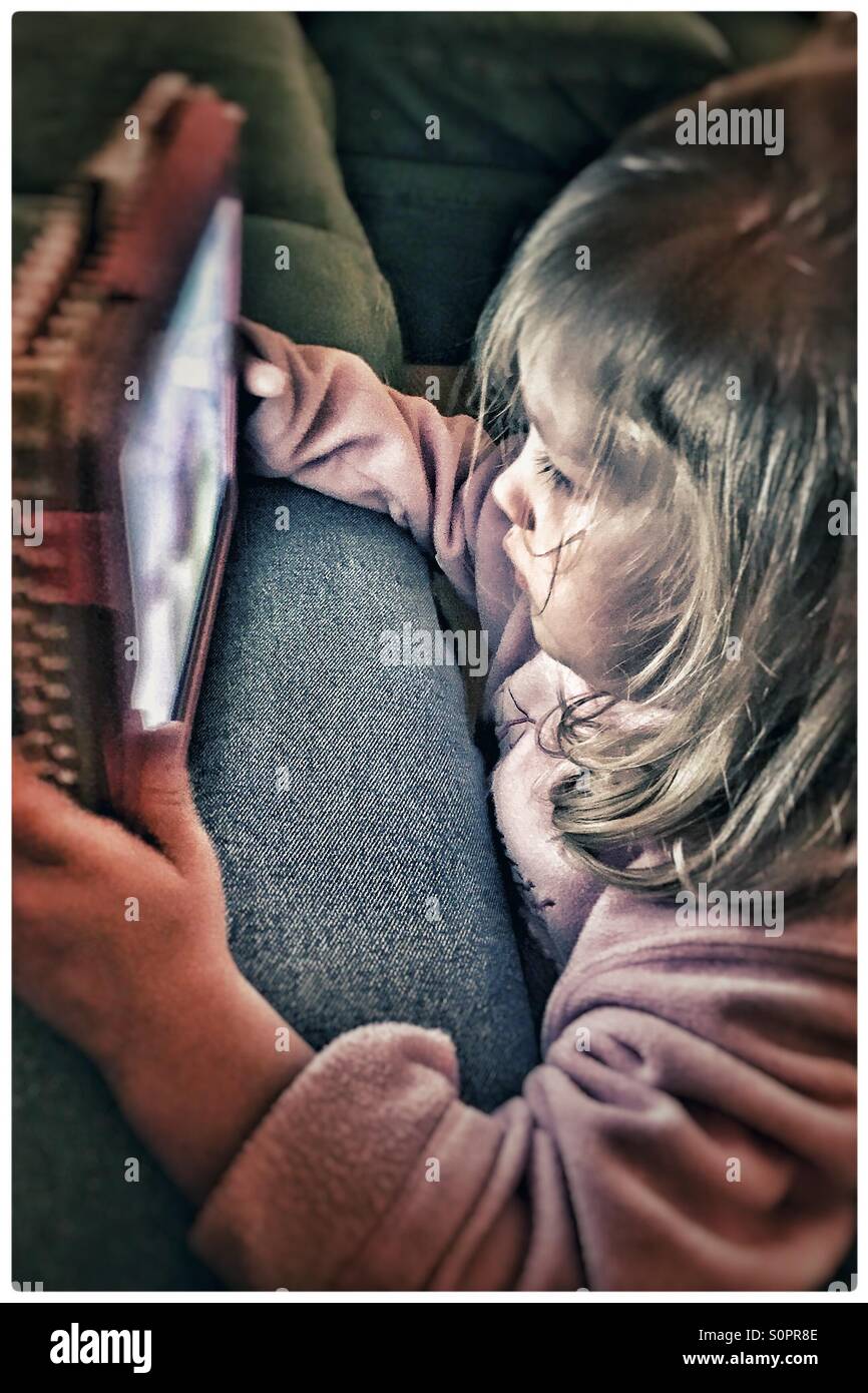 Little girl using a tablet Stock Photo