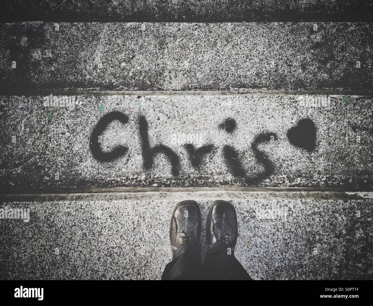 Name Chris written on the steps - Smartphone Captured Stock Image