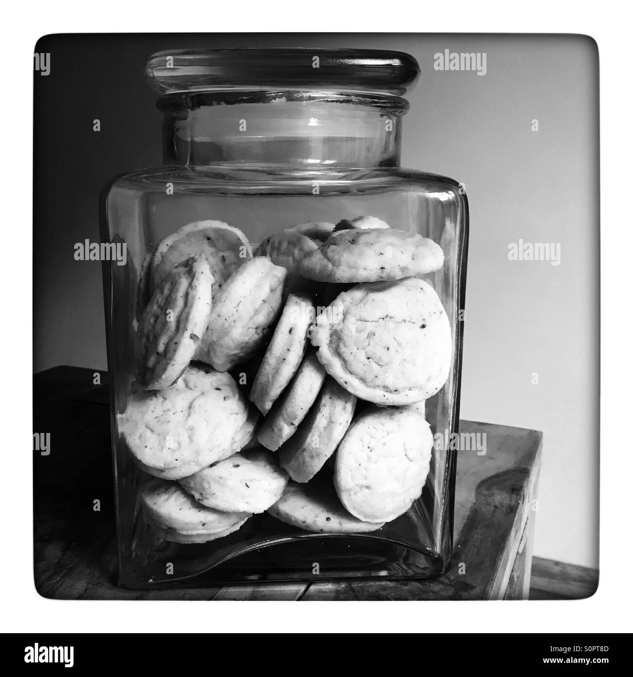 Cakes in jar on kitchen table - Smartphone Captured Stock Image
