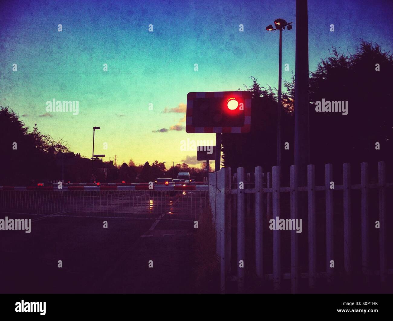 Cars waiting at level crossing England UK United Kingdom GB Great Britain - Smartphone Captured Stock Image