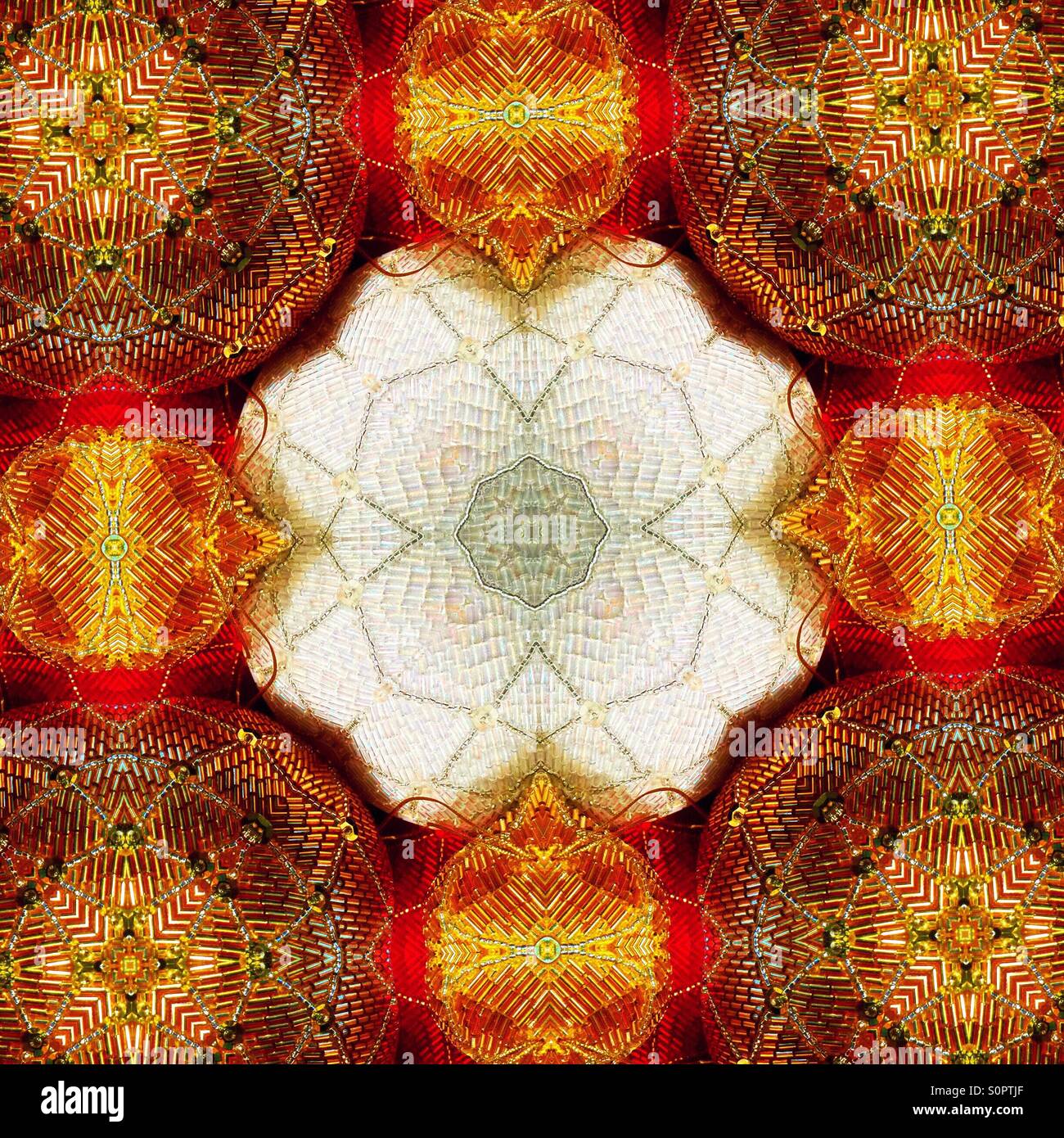 A macro view of a kaleidoscopic image of sequined balls that form a flower shape in be center - Smartphone Captured Stock Image
