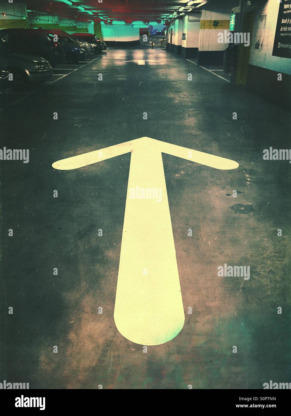 Arrow sign in parking lot Stock Photo Alamy