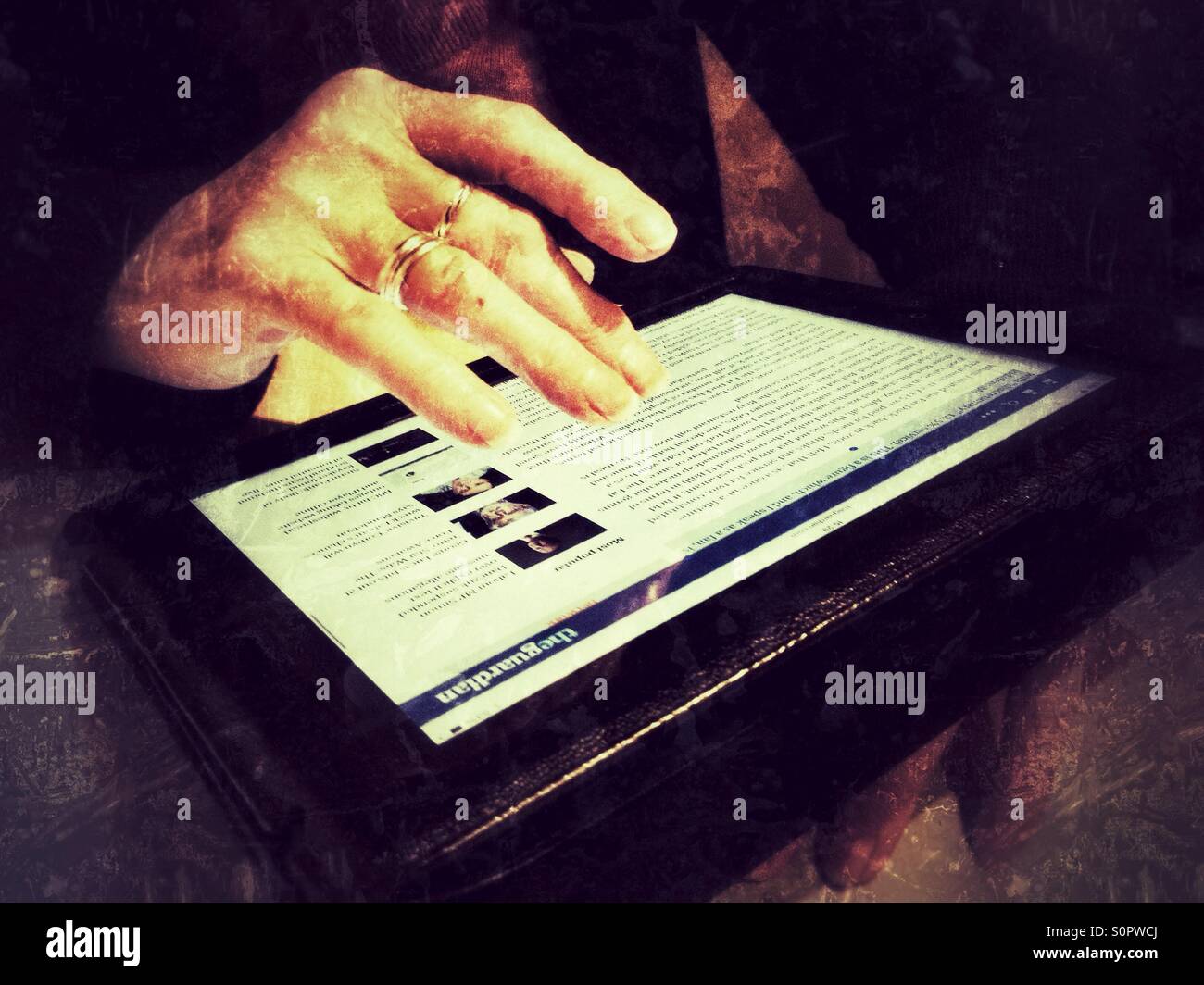 A woman surfing the Internet using an iPad. - Smartphone Captured Stock Image A woman surfing the Internet using an iPad. - Smartphone Captured Stock Image