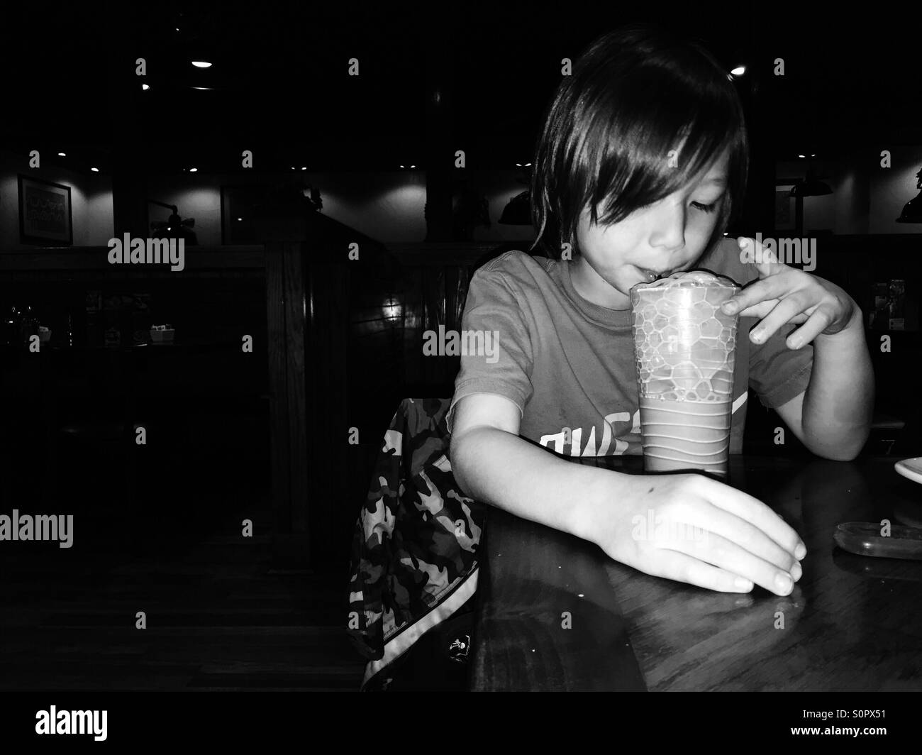 Boy drinking chocolate milk Stock Photo