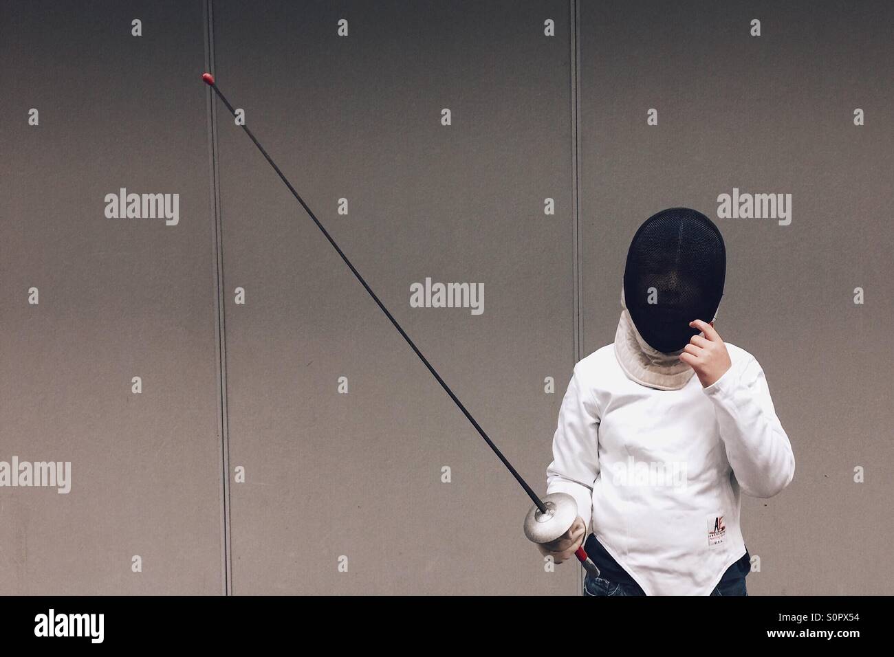 Boy in fencing gear. Stock Photo