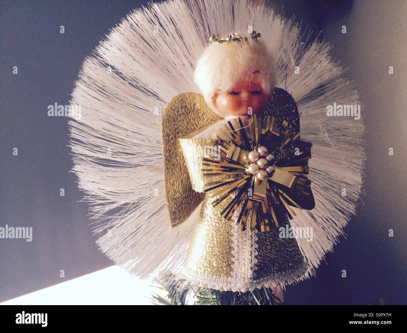 Angel ornament on top of Christmas tree Stock Photo Alamy