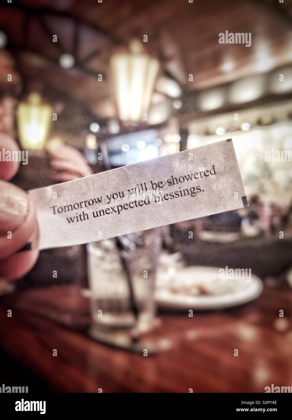 Fortune cookie message in Chinese restaurant Stock Photo Alamy