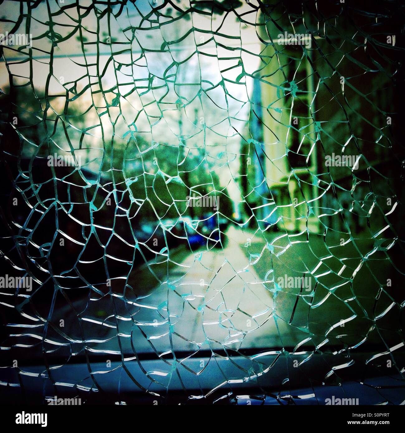 Broken Glass and a city street in the background - Smartphone Captured Stock Image