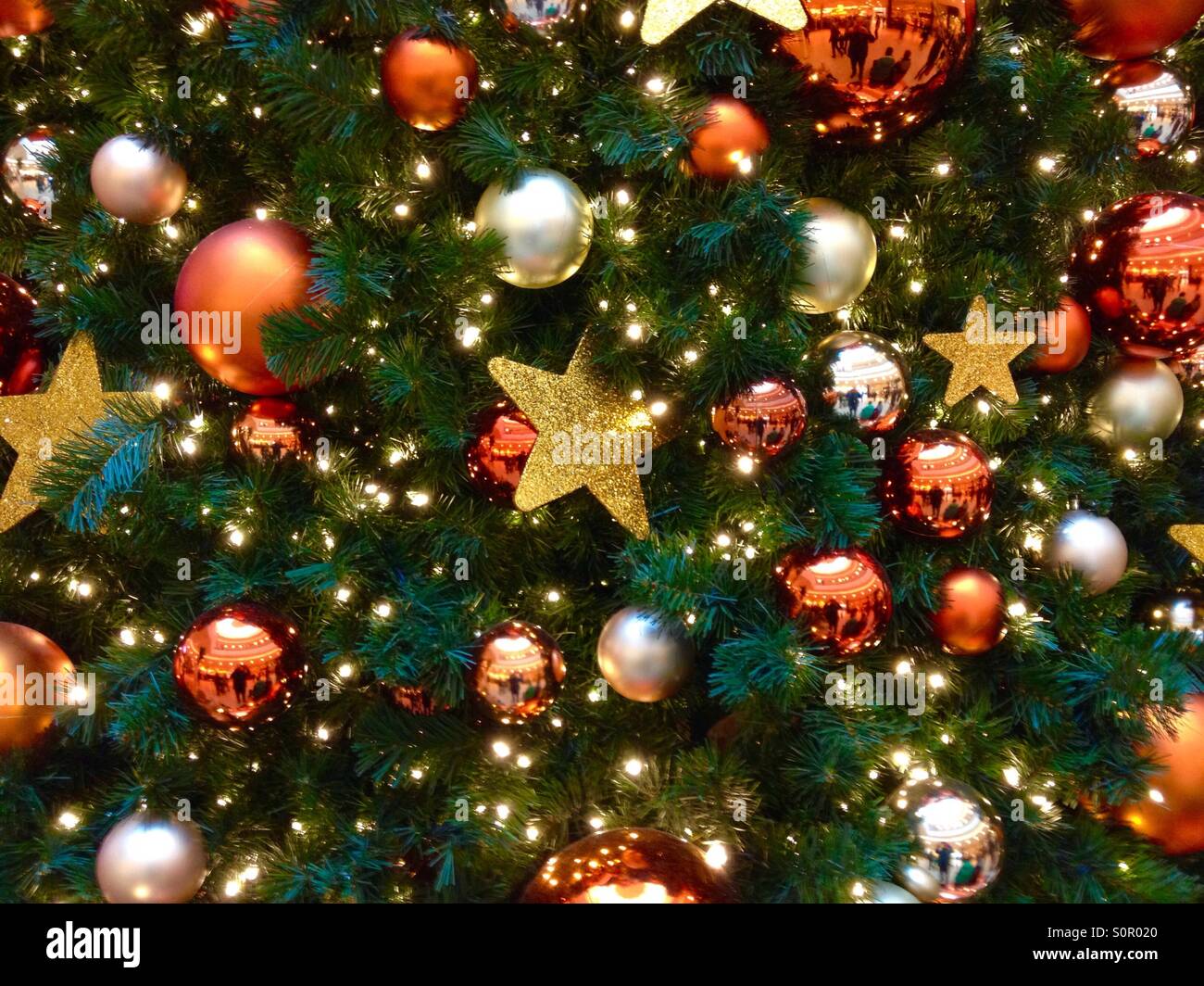Christmas tree decorated in colourful baubles - Smartphone Captured Stock Image