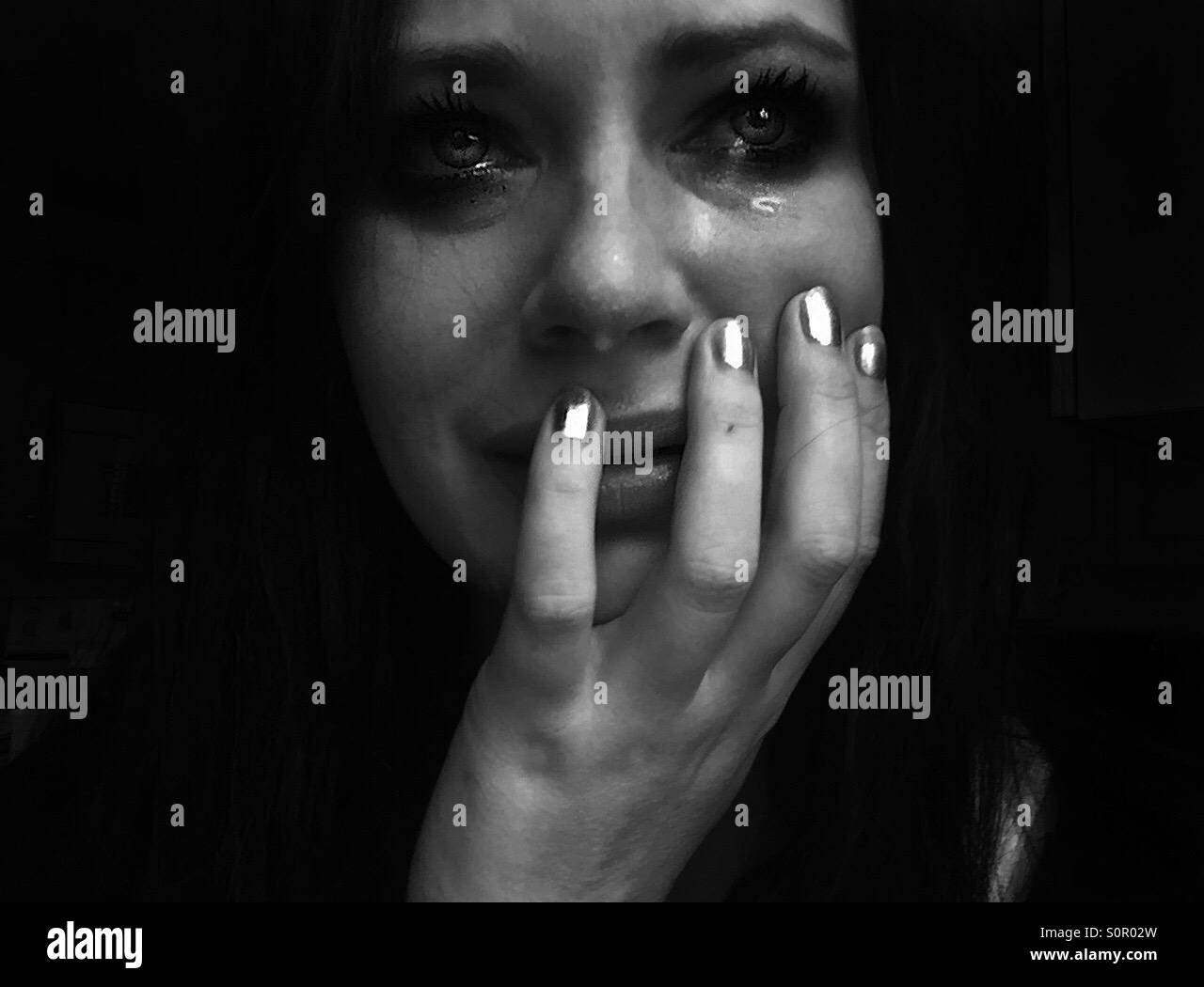 Black and white closeup of woman crying Stock Photo