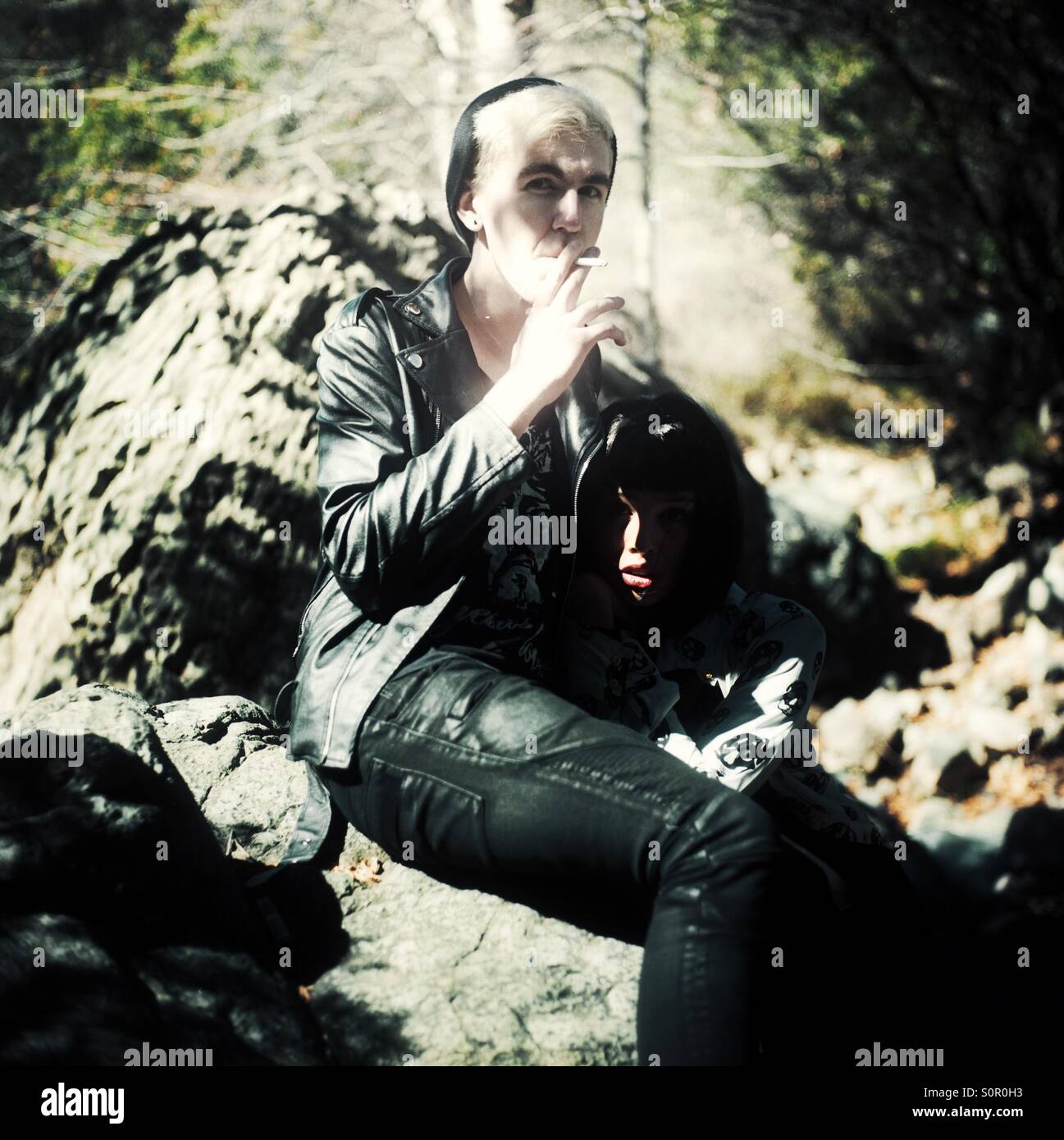 Young man and woman posing in nature Stock Photo - Alamy