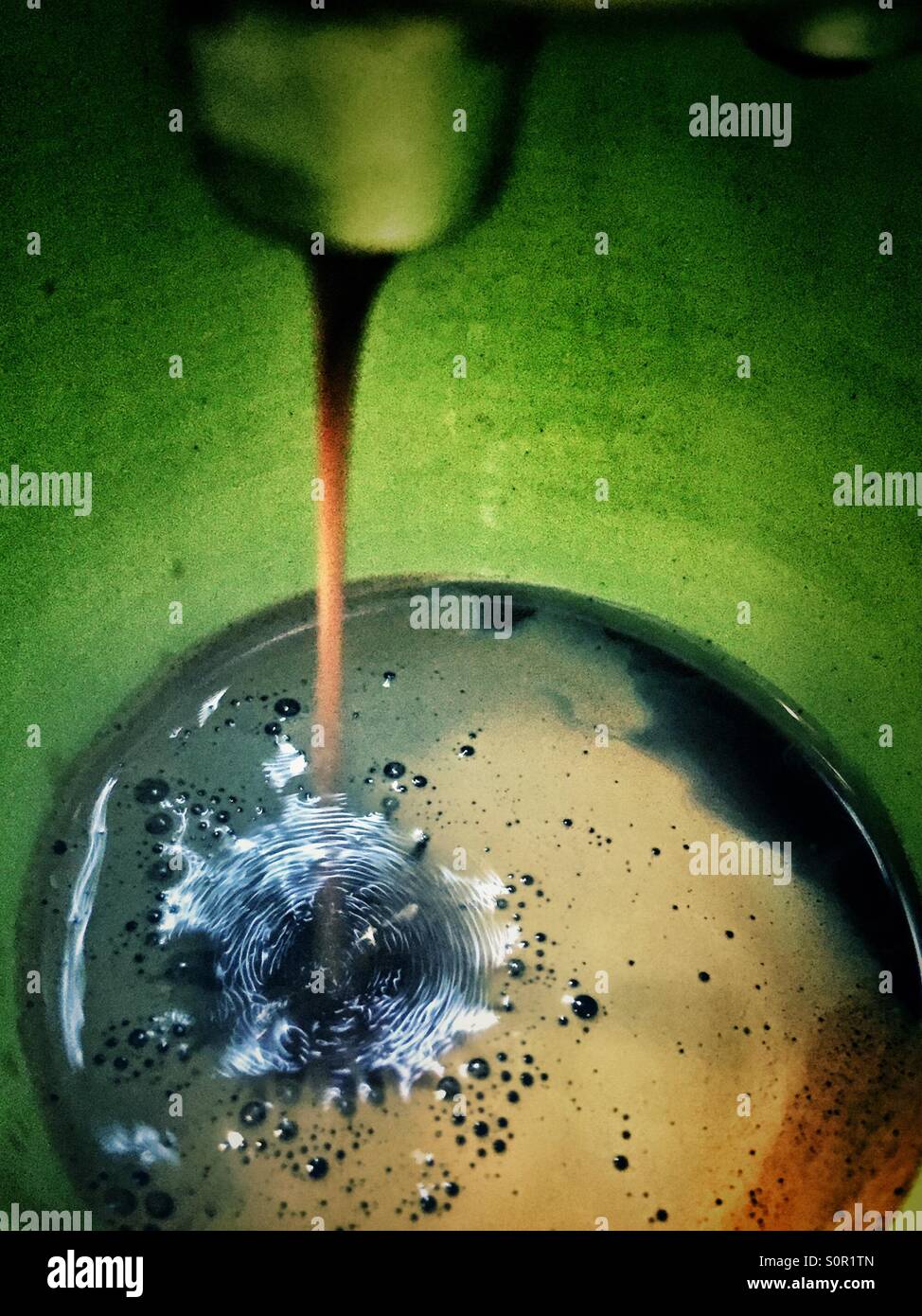 Making an expresso coffee in a home coffee machine - Smartphone Captured Stock Image