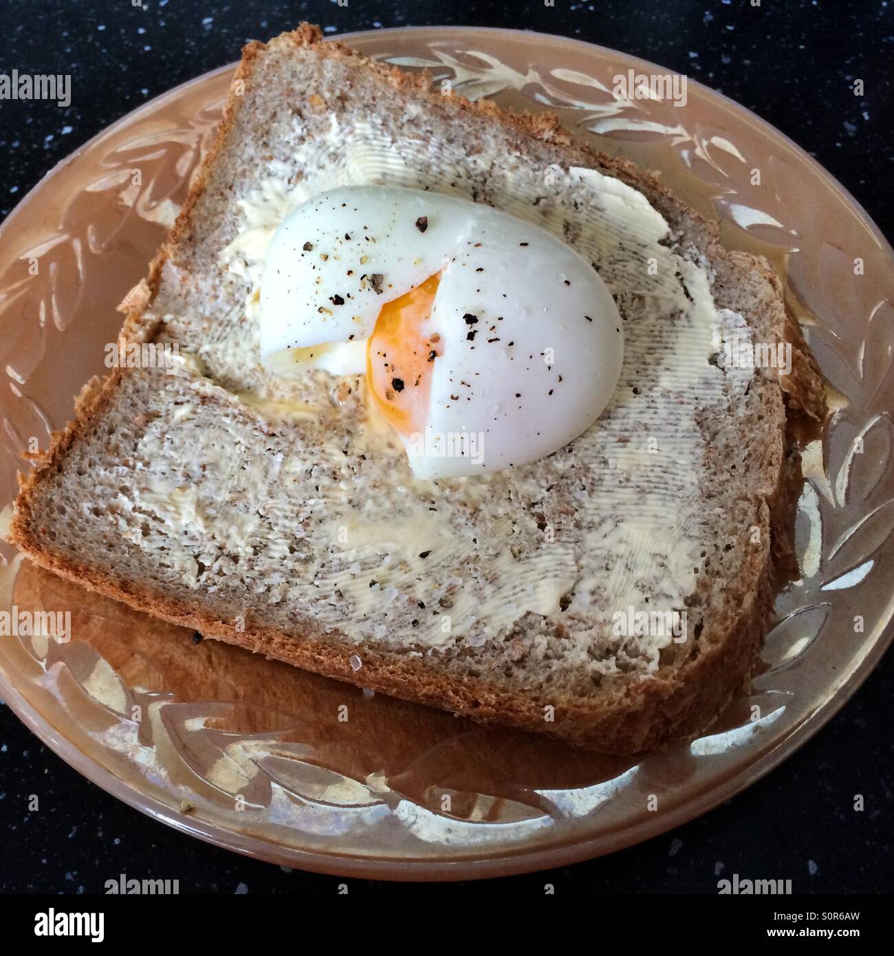 Boiled egg on a piece of home made brown bread - Smartphone Captured Stock Image