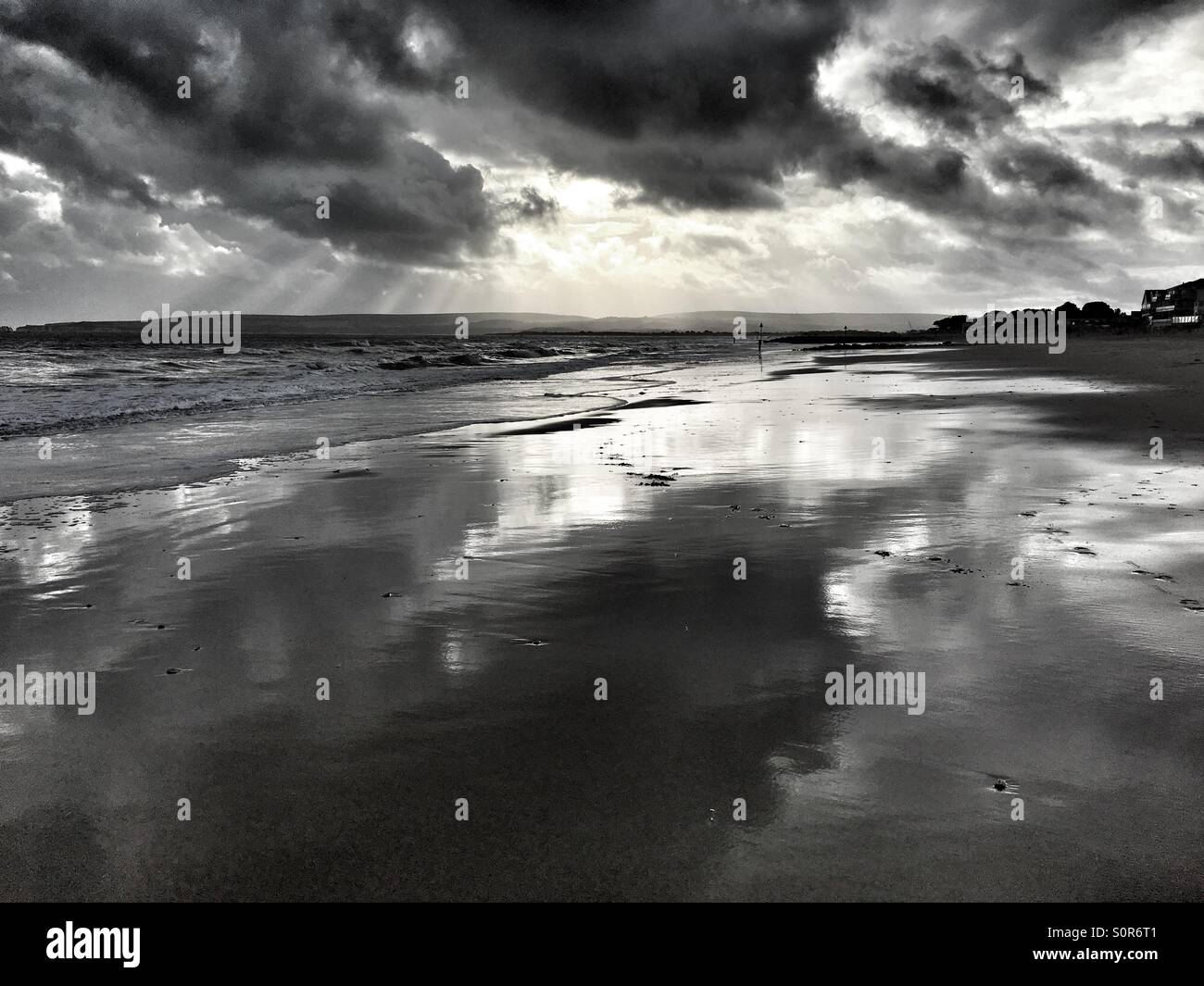 Wet beach reflecting dramatic winter sky - Smartphone Captured Stock Image Wet beach reflecting dramatic winter sky - Smartphone Captured Stock Image