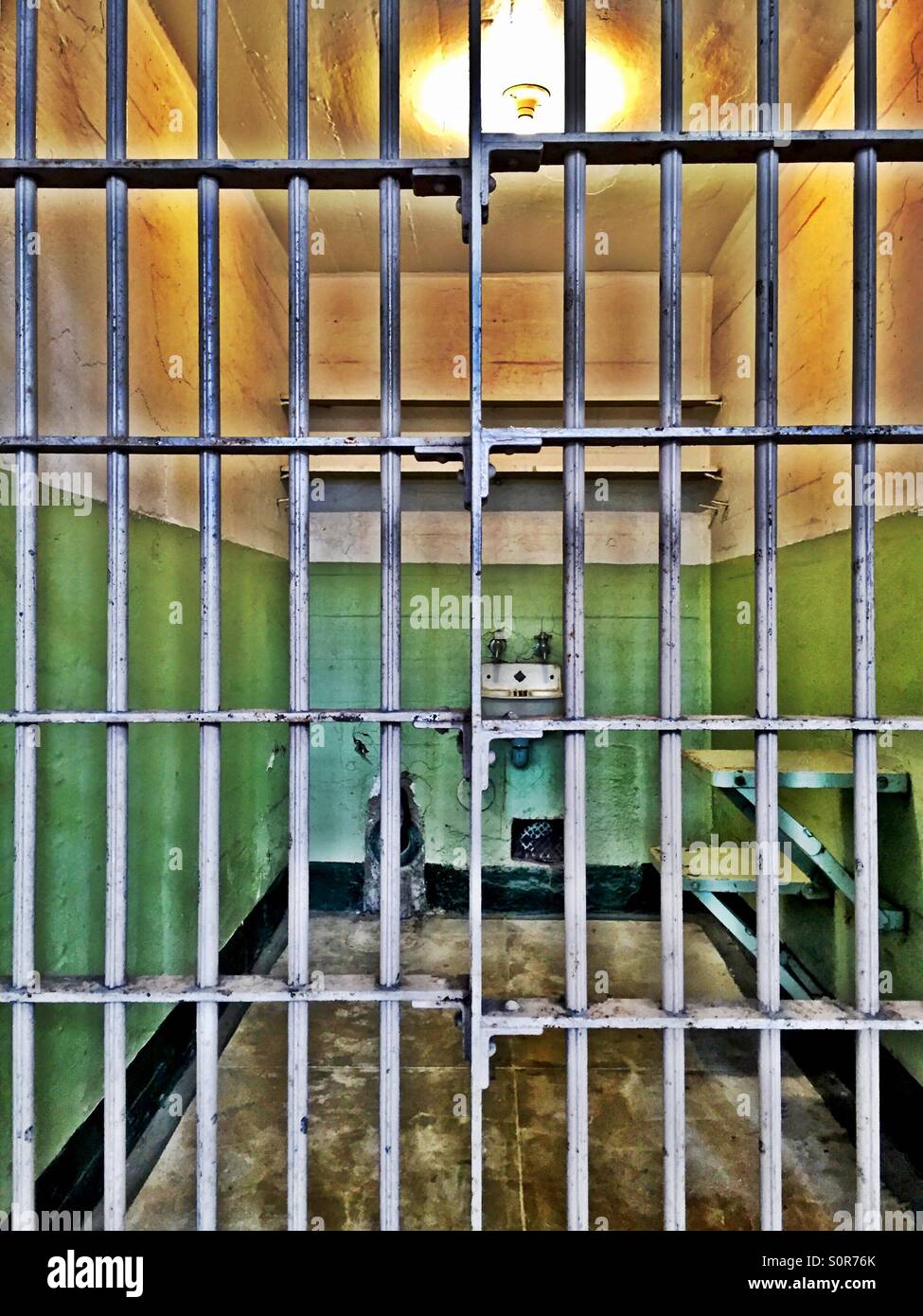 Cold, dank prison cell at historic Alcatraz federal penitentiary. - Smartphone Captured Stock Image