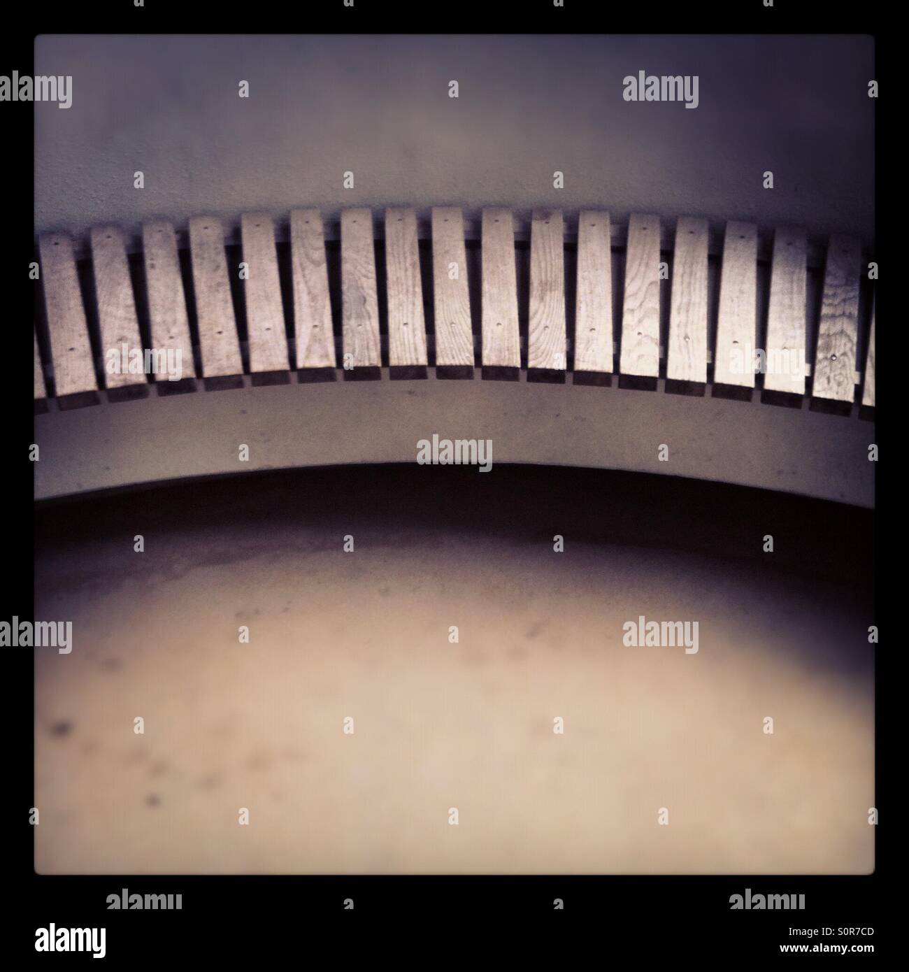 Curved wooden bench Stock Photo - Alamy