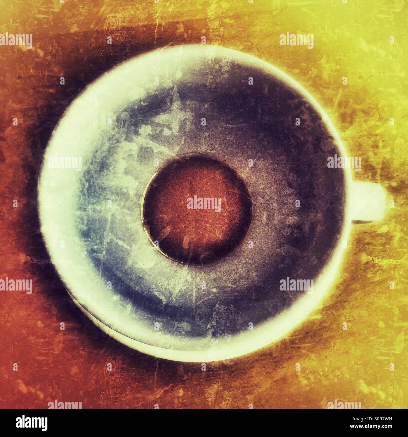 A cup of tea with just the dregs after having been drunk - Smartphone Captured Stock Image