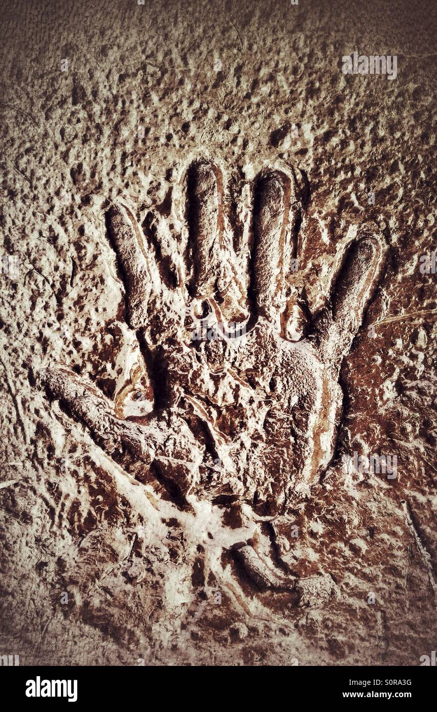 Handprint in mud. Stock Photo