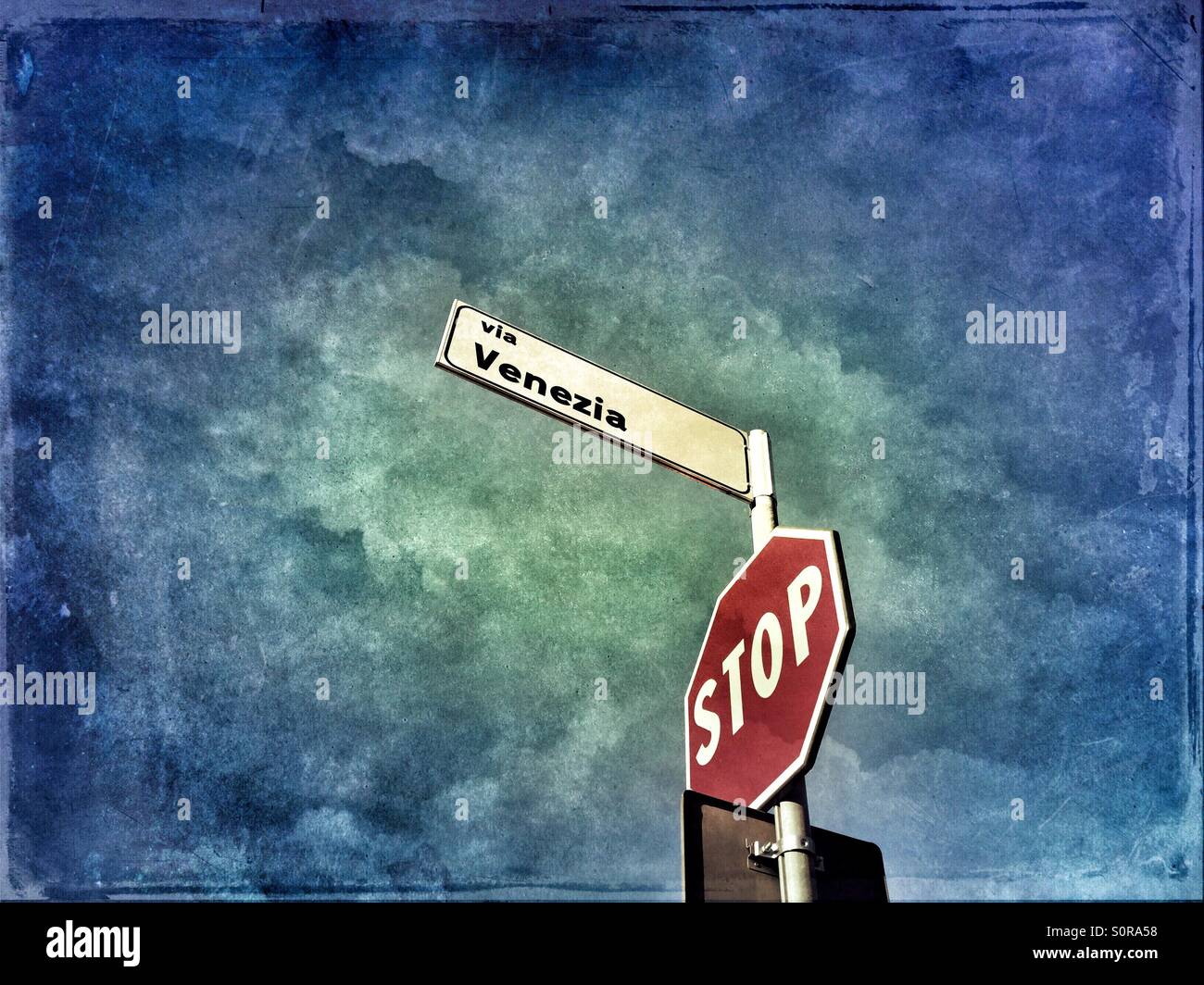 Stop sign and Via Venezia street sign - Smartphone Captured Stock Image