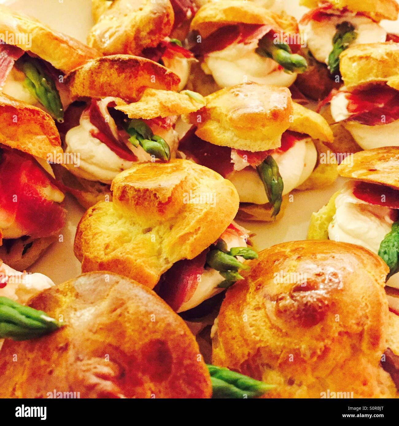 Petit four of salted whipped cream with wild asparagus and jamon iberico de bellota (ham) - Smartphone Captured Stock Image