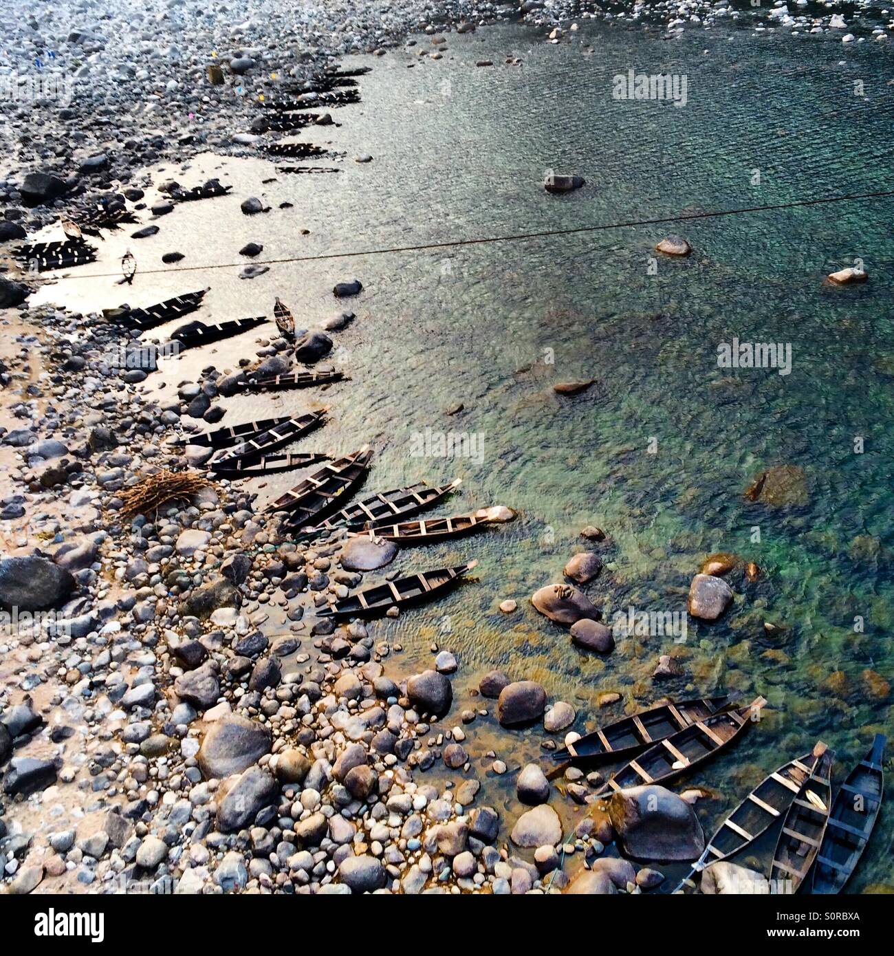 Boats on the river bank Stock Photo - Alamy
