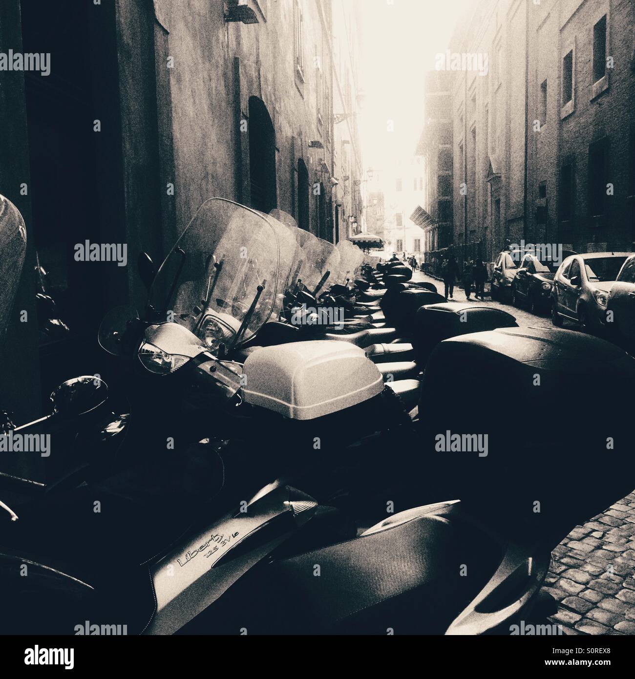Row of mopeds on a side street in Rome - Smartphone Captured Stock Image