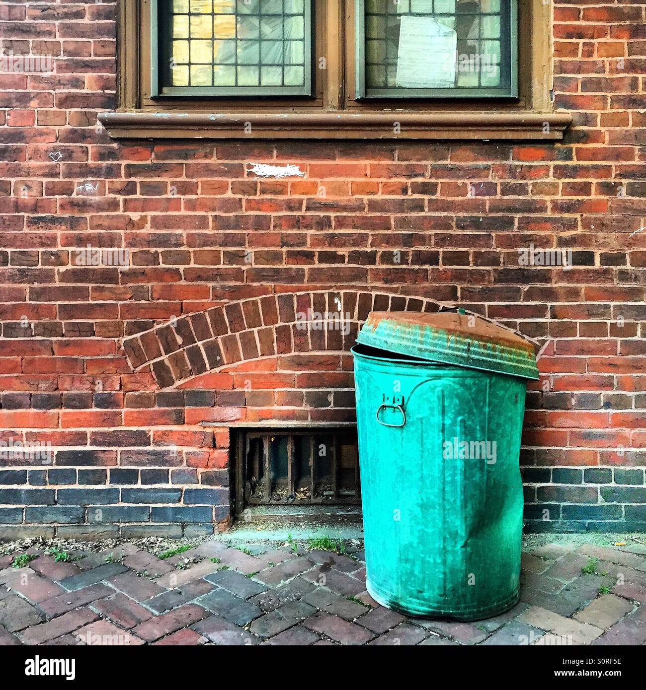 Trash can on a city street Stock Photo Alamy
