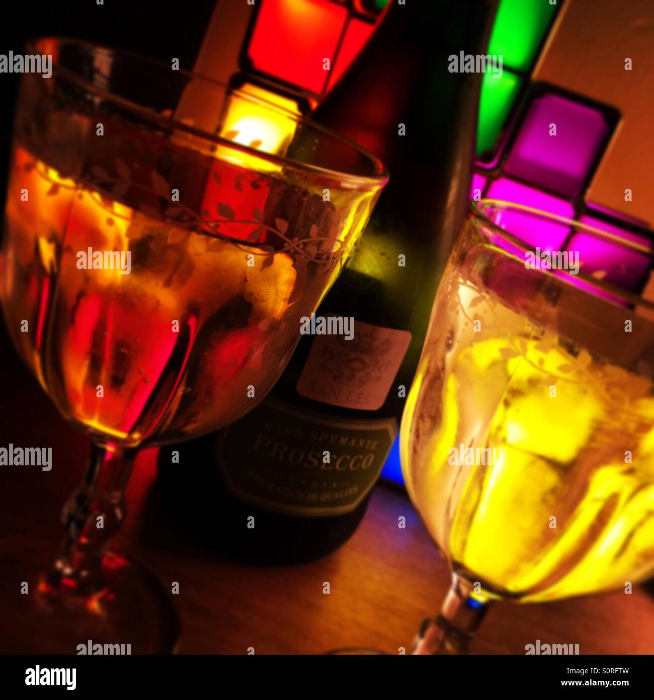 Glasses of Prosecco against coloured cubes - Smartphone Captured Stock Image