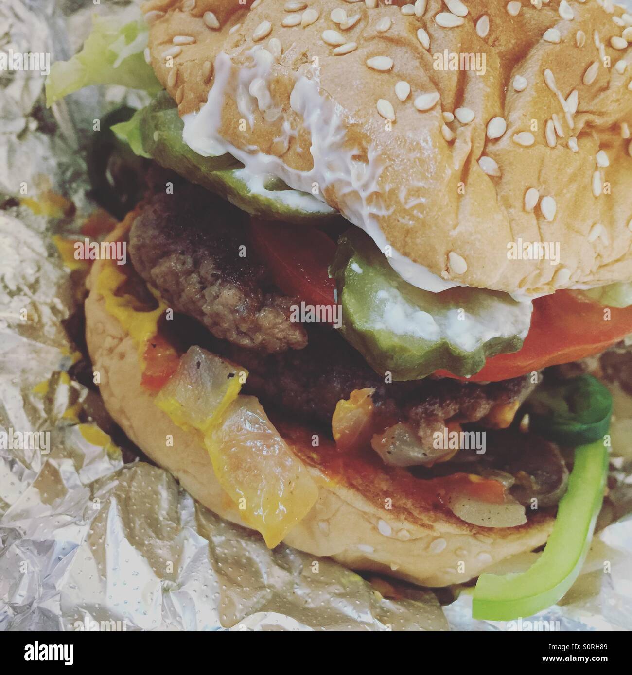 Juicy double burger from restaurant Stock Photo
