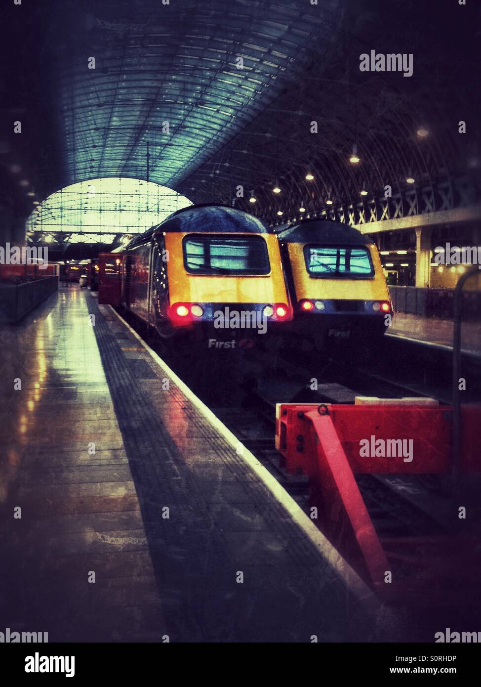 A couple of First Great Western intercity trains wait to leave Paddington railway station in London. - Smartphone Captured Stock Image