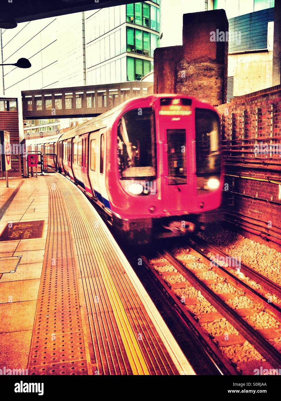 A London Underground train arrives at Paddington Station on the