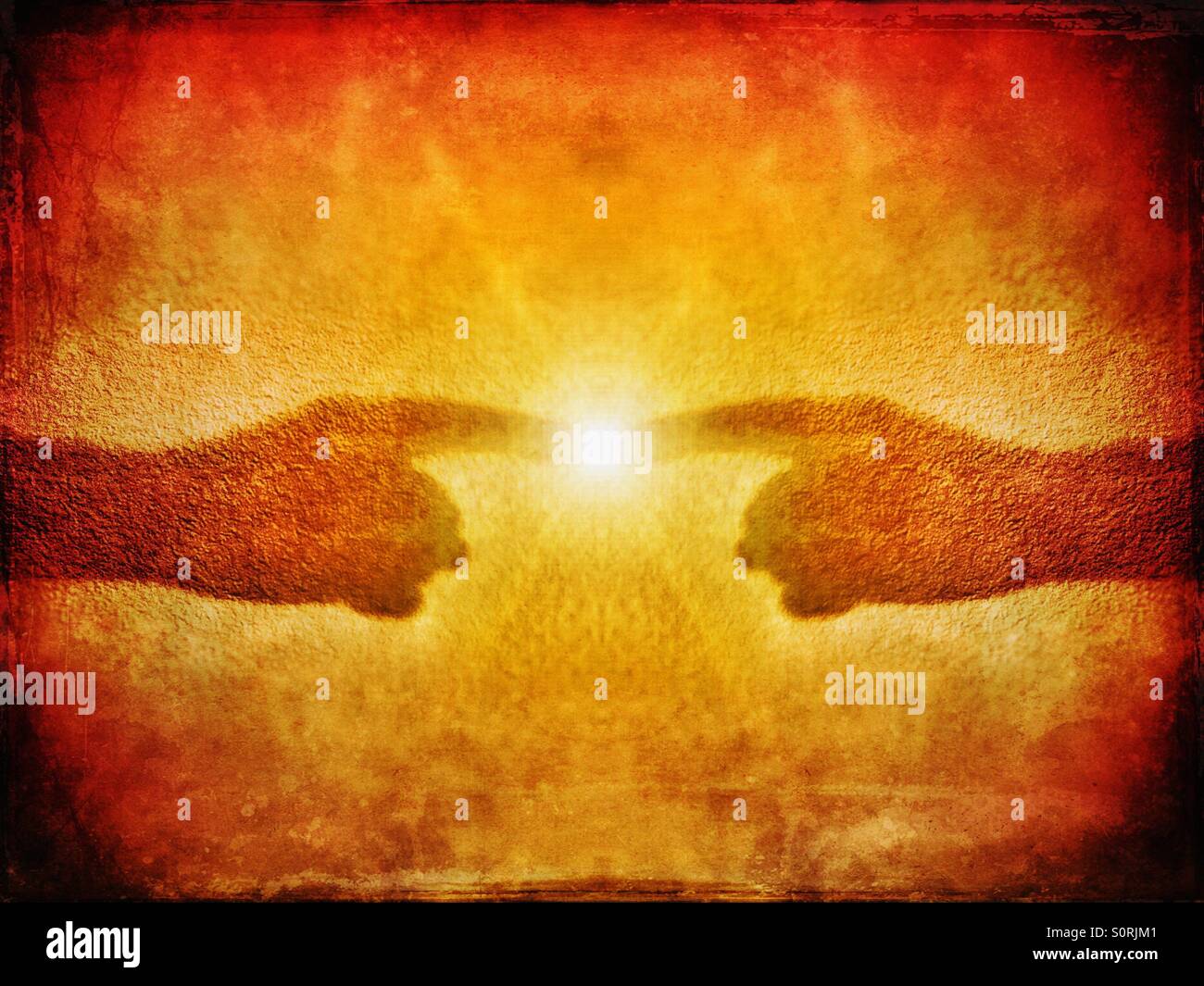 Spark of energy between shadow of two pointing hands - Smartphone Captured Stock Image