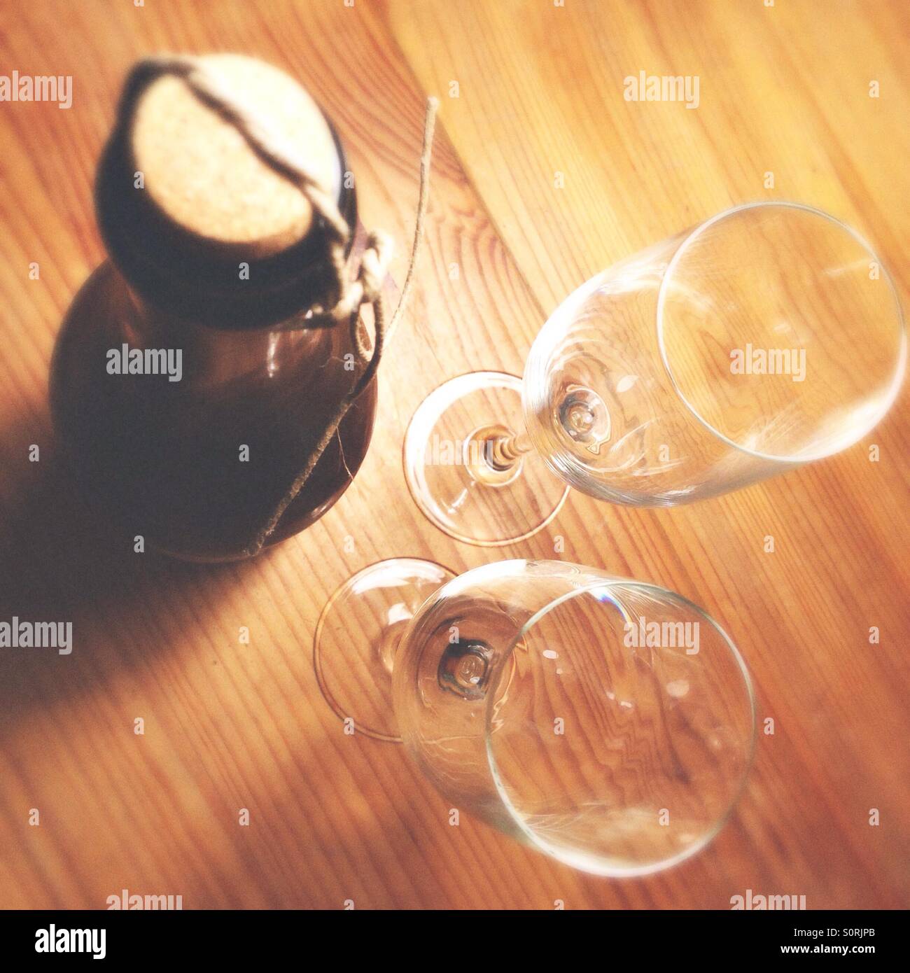 Closed champagne bottle and two empty glasses - Smartphone Captured Stock Image