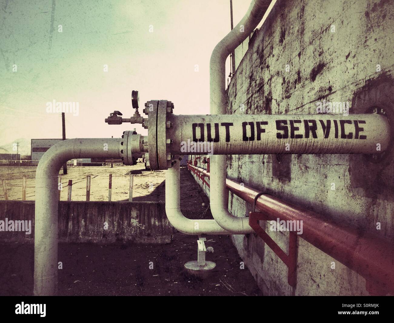 Out of service sign written on the pipe at oil refinery plant in Tacoma, Washington state Stock Photo