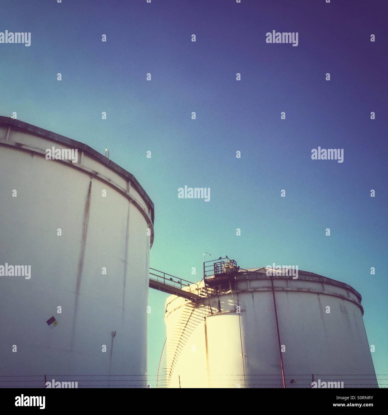 Two cylindrical towers at Tacoma Oil Storage and Refinery - Smartphone Captured Stock Image